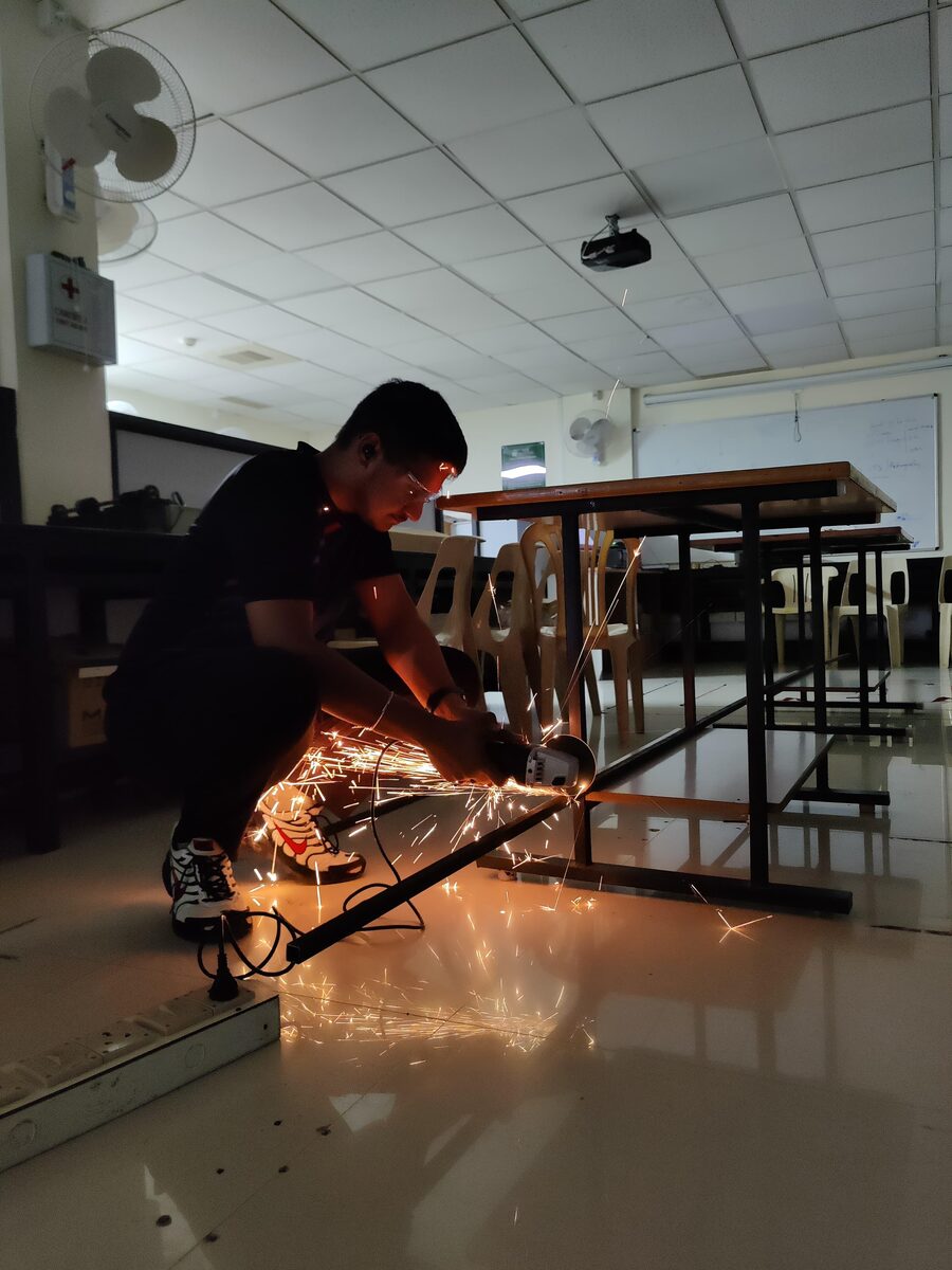 Fabricating the Qubi bot chassis with an angle grinder